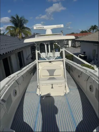  Yacht Photos Pics 2004 Hydra-Sports Vector 33 CC boat with Garmin equipment, docked under a clear sky.