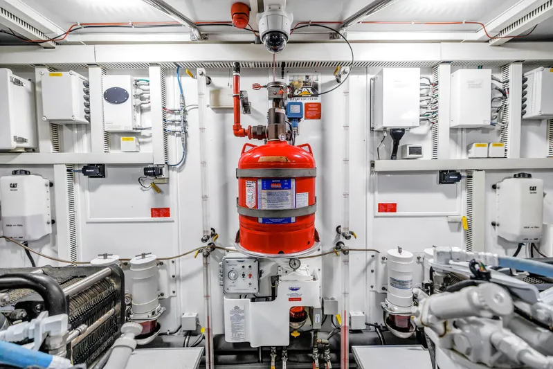Encore Yacht Photos Pics Engine room of 2015 Horizon E88 yacht with fire suppression system and control panels.