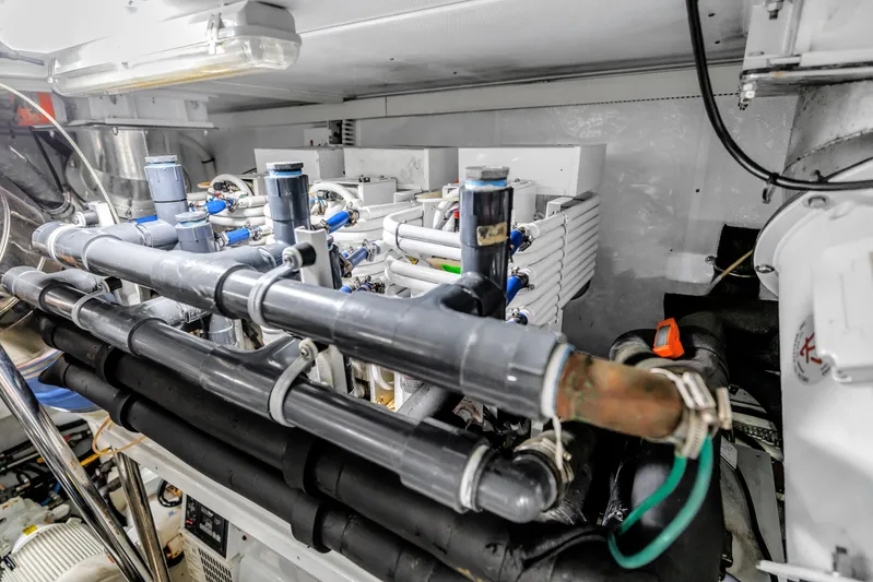 Encore Yacht Photos Pics Engine room of 2015 Horizon E88 yacht with complex piping system.