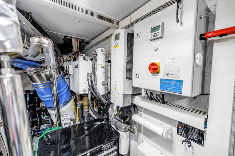 Encore Yacht Photos Pics Engine room of 2015 Horizon E88 yacht with control panels and piping.