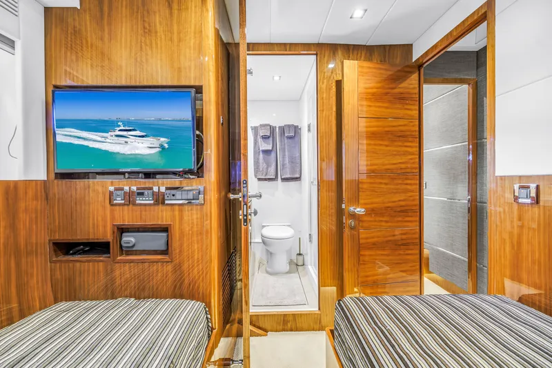 Encore Yacht Photos Pics Luxurious interior of 2015 Horizon E88 yacht with TV and ensuite bathroom.