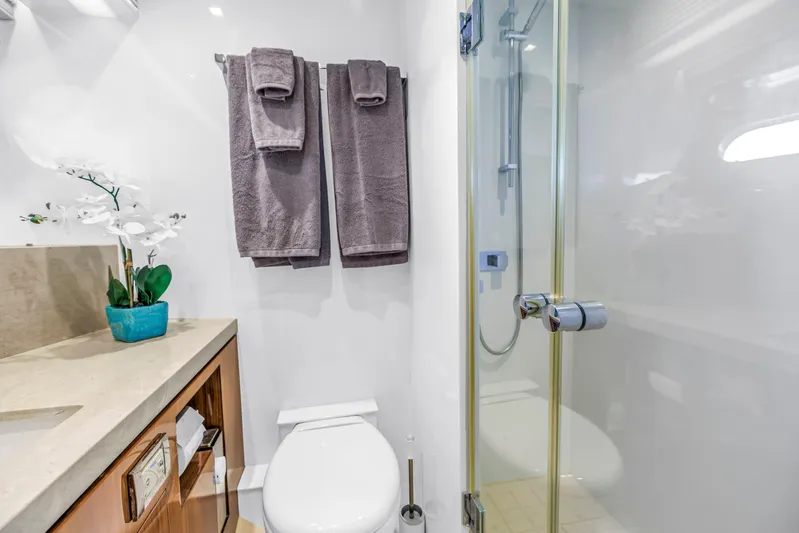 Encore Yacht Photos Pics Luxurious bathroom in 2015 Horizon E88 yacht with shower, towels, and elegant decor.