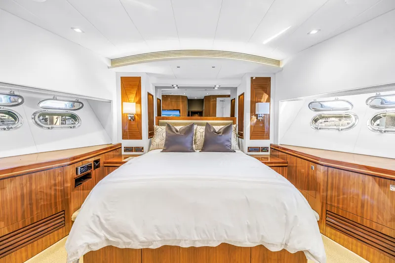 Encore Yacht Photos Pics Luxurious bedroom interior of 2015 Horizon E88 yacht with elegant wood finishes and modern design.