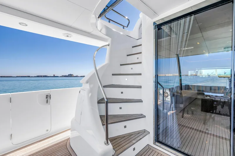 Encore Yacht Photos Pics Luxurious Horizon E88 yacht interior with spiral staircase, ocean view, and modern design, 2015 model.