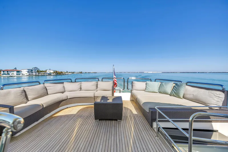 Encore Yacht Photos Pics Luxurious Horizon E88 yacht deck with plush seating, overlooking serene waters, 2015 model.