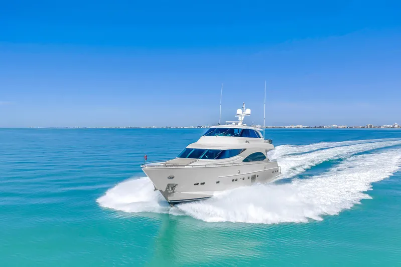 Encore Yacht Photos Pics Luxurious 2015 Horizon E88 yacht cruising on clear blue ocean waters.