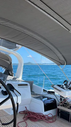  Yacht Photos Pics Jeanneau 64 yacht cockpit with ocean view, 2021 model, featuring modern sailing equipment.