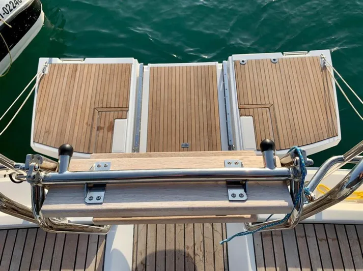  Yacht Photos Pics Jeanneau 64 yacht's teak swim platform, 2021 model, with stainless steel ladder.