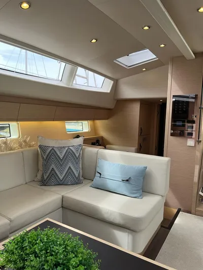  Yacht Photos Pics Luxurious interior of 2021 Jeanneau 64 yacht with elegant seating and modern decor.