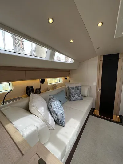  Yacht Photos Pics Luxurious interior of 2021 Jeanneau 64 yacht with elegant seating and modern design.