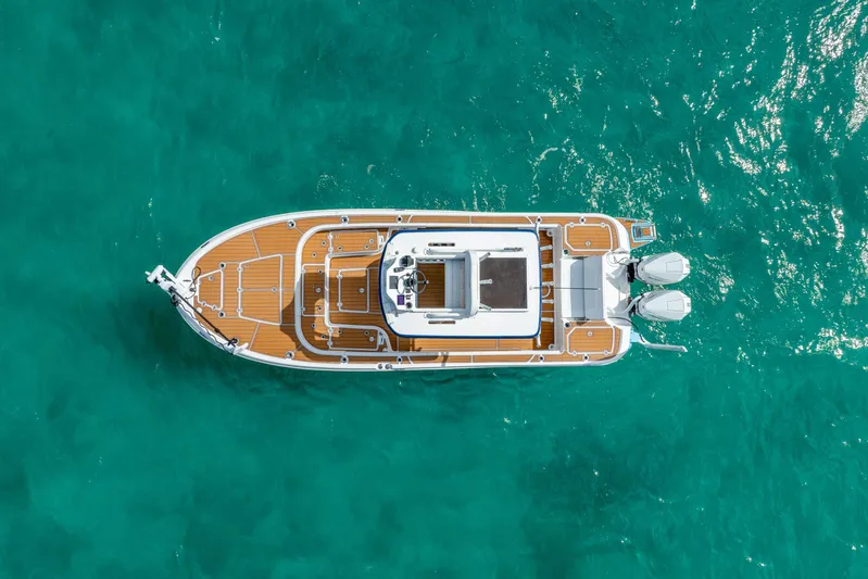  Yacht Photos Pics Overhead view of 2024 Caymas 281 HB boat on turquoise water.