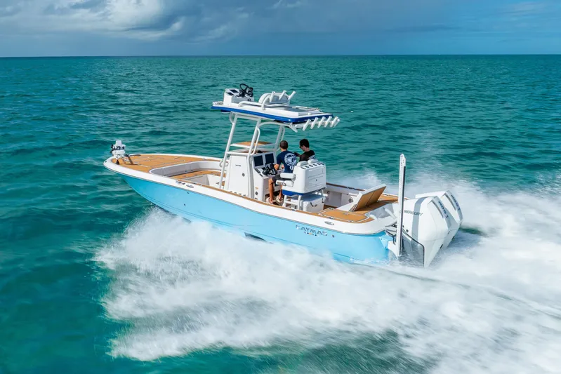  Yacht Photos Pics 2024 Caymas 281 HB boat cruising on open ocean waters.