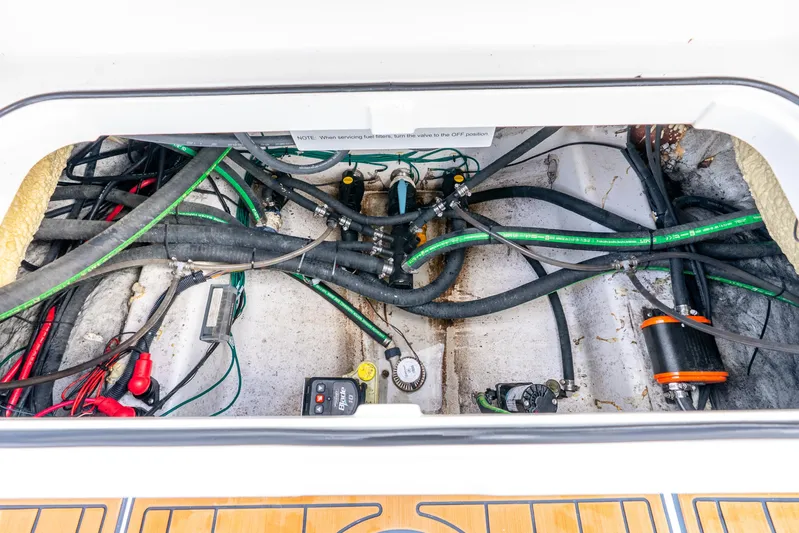  Yacht Photos Pics 2024 Caymas 281 HB boat engine compartment with visible wiring and hoses.