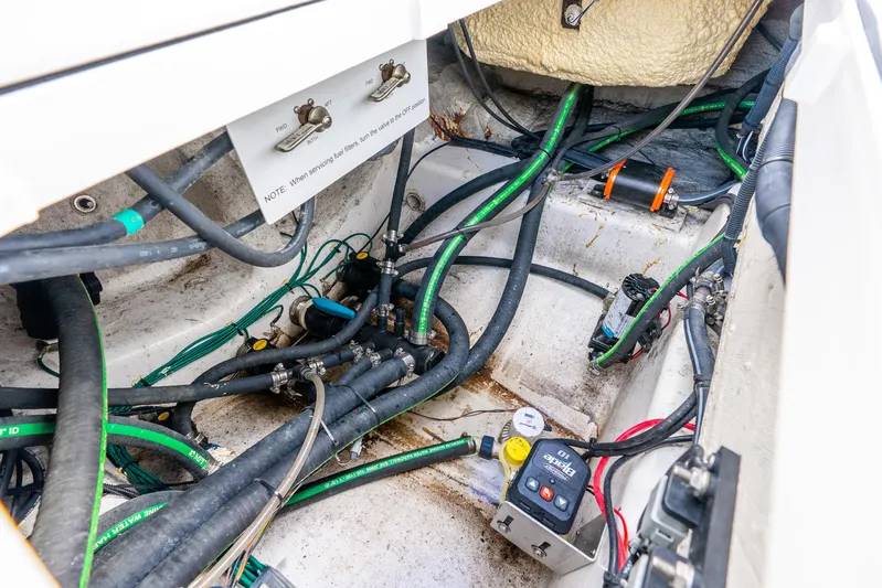  Yacht Photos Pics 2024 Caymas 281 HB boat engine compartment with wiring and fuel lines.