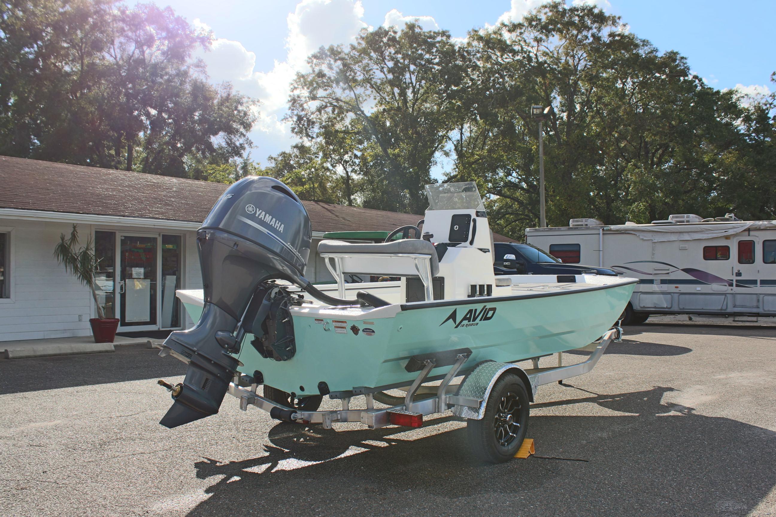 2025 Avid 18 Rogue CC boat with Yamaha engine on trailer, parked outdoors.