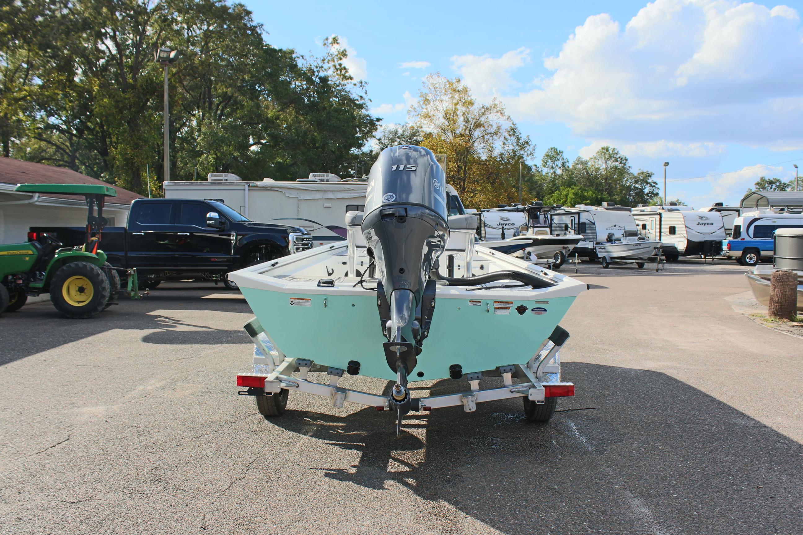 2025 Avid 18 Rogue CC boat on trailer in parking lot.