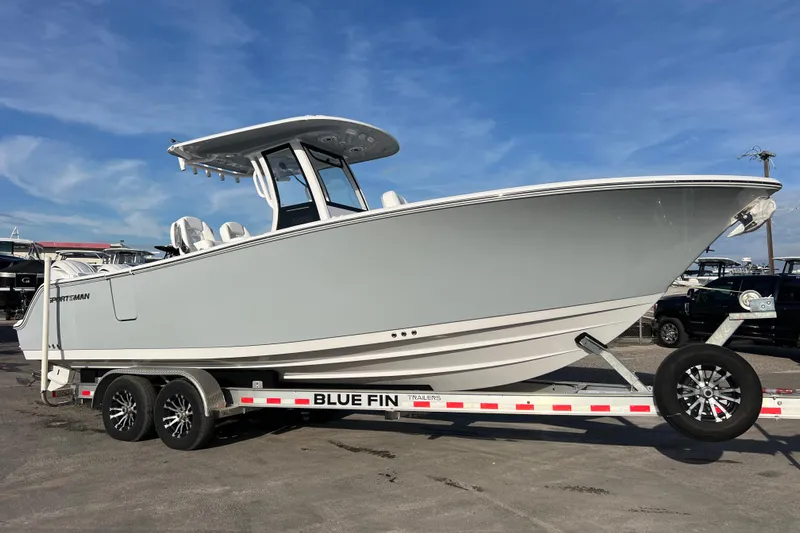  Yacht Photos Pics 2026 Sportsman Heritage 261 Center Console boat on trailer under blue sky.