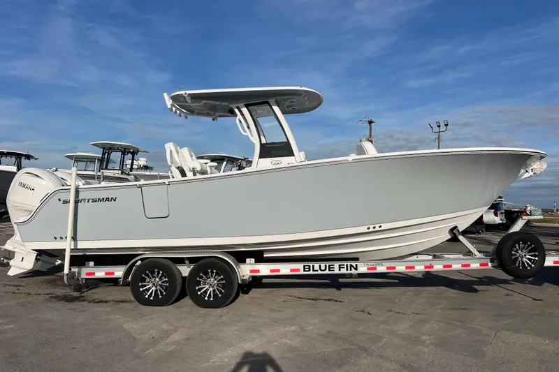  Yacht Photos Pics 2026 Sportsman Heritage 261 Center Console boat on trailer, side view.