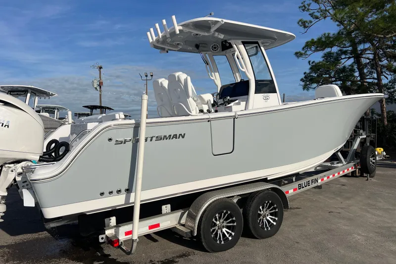  Yacht Photos Pics 2026 Sportsman Heritage 261 Center Console boat on trailer, side view.