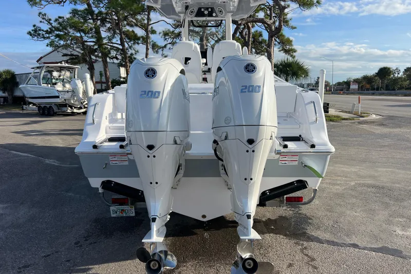  Yacht Photos Pics 2026 Sportsman Heritage 261 Center Console with dual Yamaha 200 engines, parked outdoors.