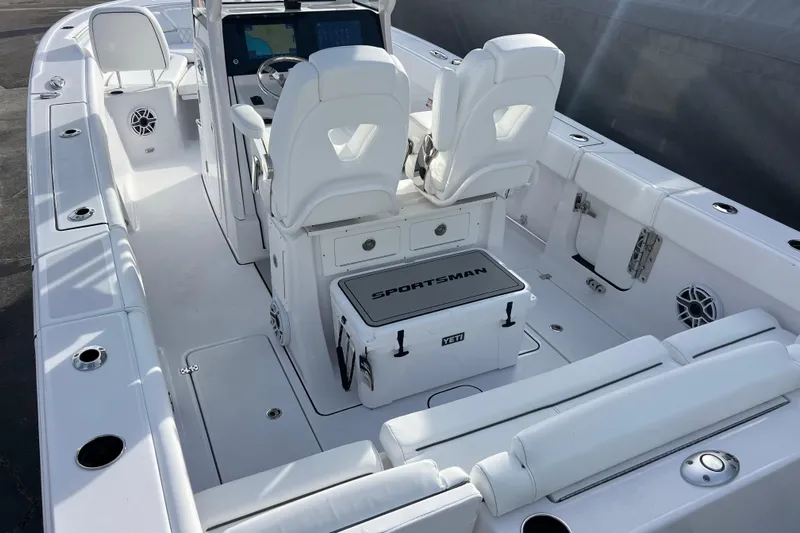  Yacht Photos Pics 2026 Sportsman Heritage 261 Center Console boat interior with white seating and modern controls.