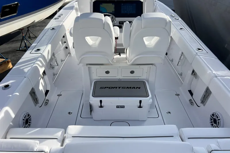  Yacht Photos Pics 2026 Sportsman Heritage 261 Center Console boat interior with white seating and Yeti cooler.