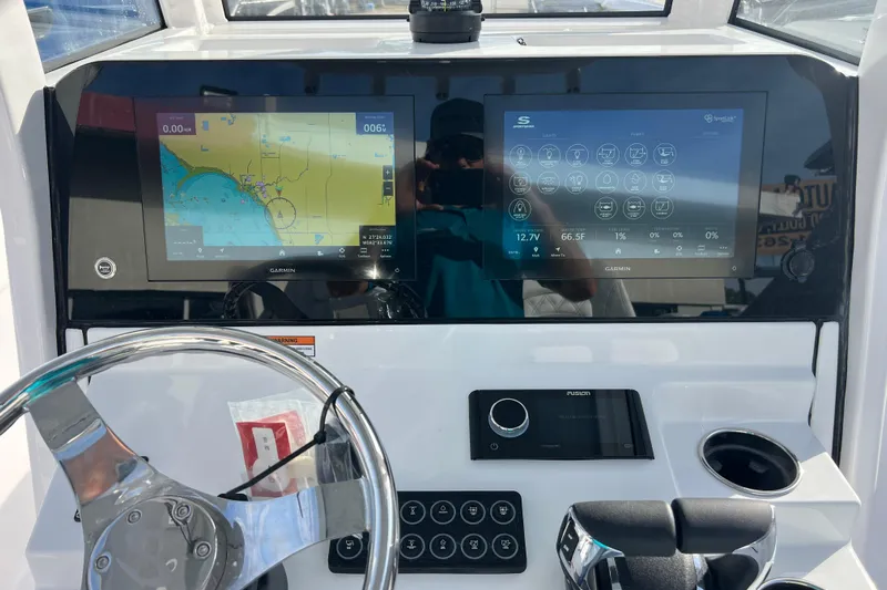  Yacht Photos Pics 2026 Sportsman Heritage 261 Center Console dashboard with dual Garmin displays and steering wheel.