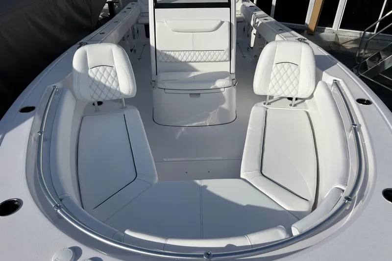  Yacht Photos Pics 2026 Sportsman Heritage 261 Center Console boat with luxurious white seating.