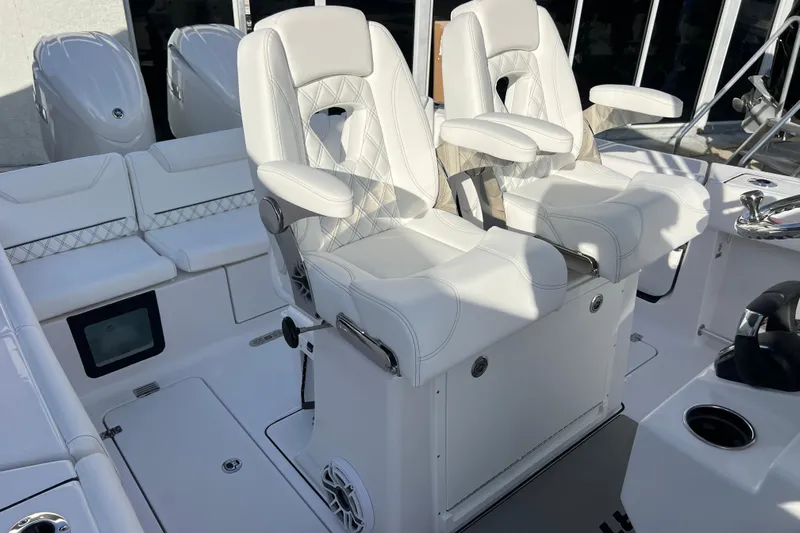  Yacht Photos Pics 2026 Sportsman Heritage 261 Center Console with luxurious white seating and modern design.