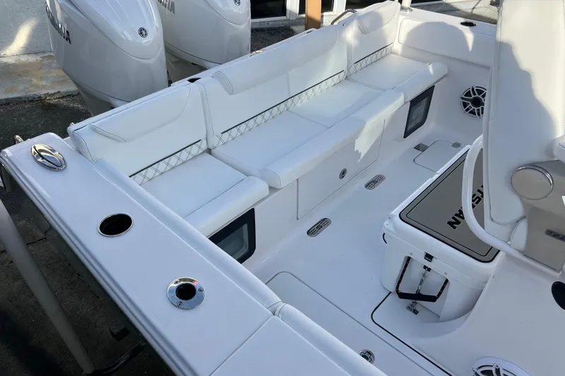  Yacht Photos Pics 2026 Sportsman Heritage 261 Center Console boat interior with white seating and storage.