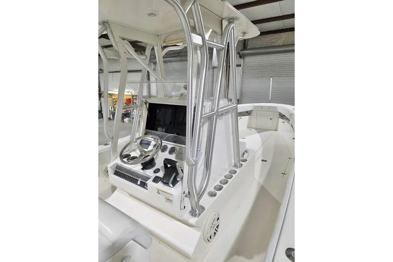  Yacht Photos Pics 2019 SeaVee 320B boat console with steering wheel and navigation equipment.