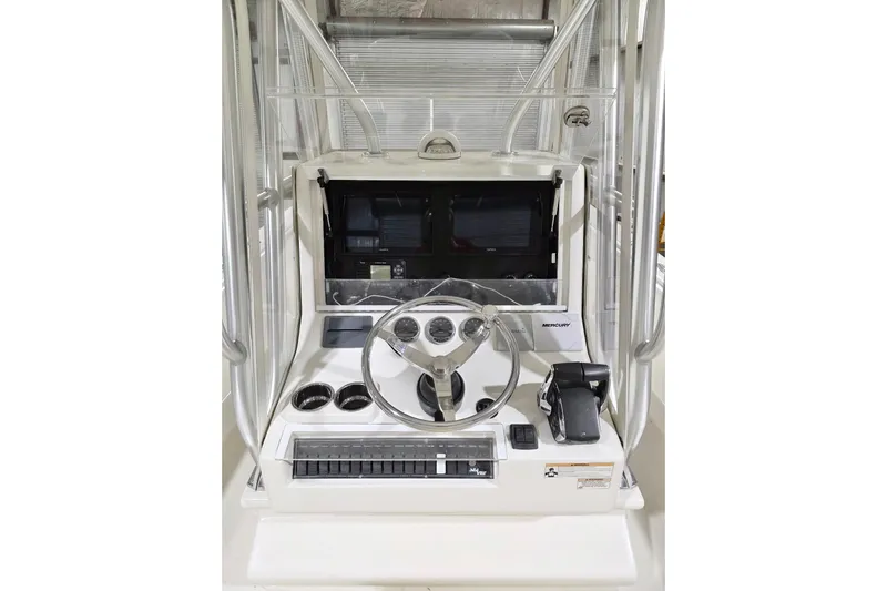  Yacht Photos Pics 2019 SeaVee 320B boat console with steering wheel and navigation controls.