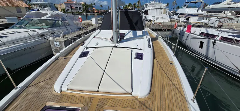 Wildflower Yacht Photos Pics 2021 Beneteau Oceanis Yacht 54 docked, showcasing sleek deck design and modern features.