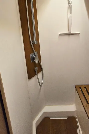 Wildflower Yacht Photos Pics Shower area in 2021 Beneteau Oceanis Yacht 54, featuring modern fixtures and wooden accents.