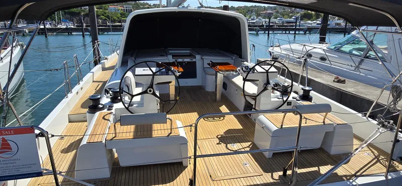 Wildflower Yacht Photos Pics Beneteau Oceanis Yacht 54, 2021 model, featuring dual steering wheels and spacious deck.