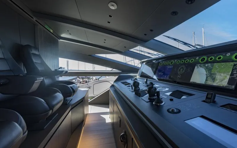  Yacht Photos Pics Luxurious 2022 Mangusta 165 REV yacht cockpit with advanced navigation controls and plush seating.