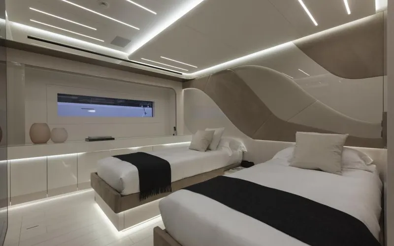  Yacht Photos Pics Luxurious interior of 2022 Mangusta 165 REV yacht with modern twin beds and elegant lighting.