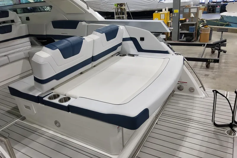  Yacht Photos Pics 2026 Formula 400 Super Sport Crossover boat interior with luxurious seating and cup holders.