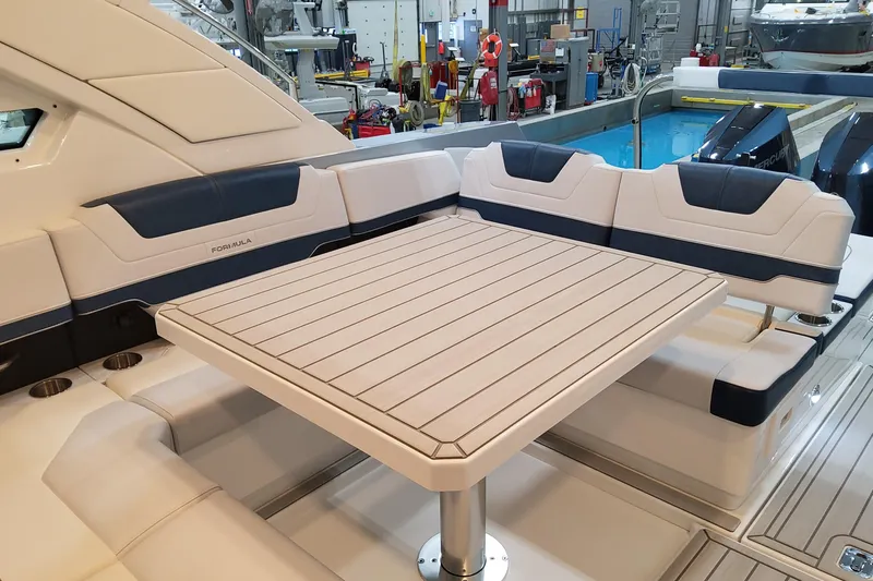  Yacht Photos Pics Luxury seating area on 2026 Formula 400 Super Sport Crossover yacht with elegant table design.