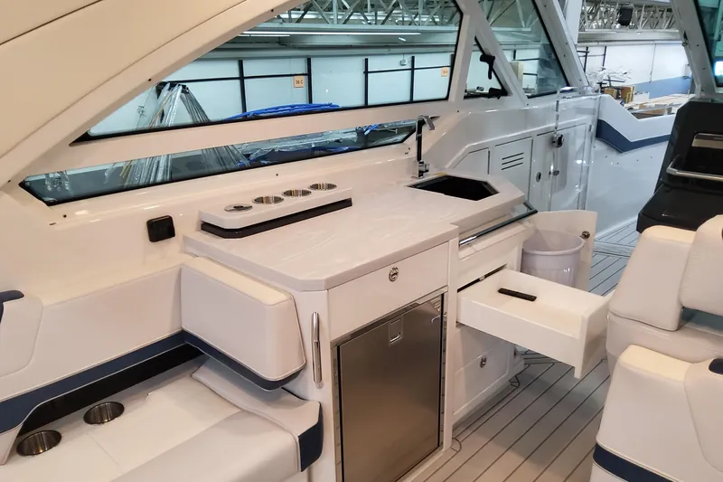  Yacht Photos Pics 2026 Formula 400 Super Sport Crossover yacht interior with sleek kitchenette and seating area.