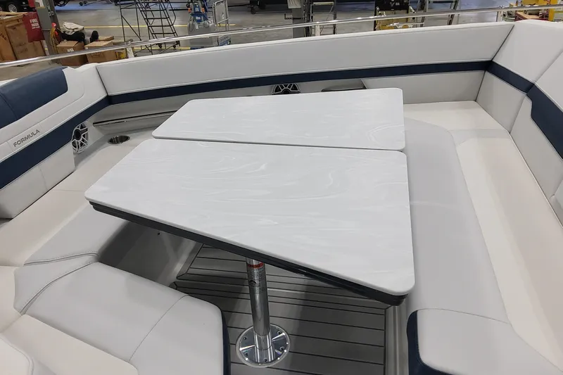  Yacht Photos Pics 2026 Formula 400 Super Sport Crossover boat interior with sleek seating and table design.