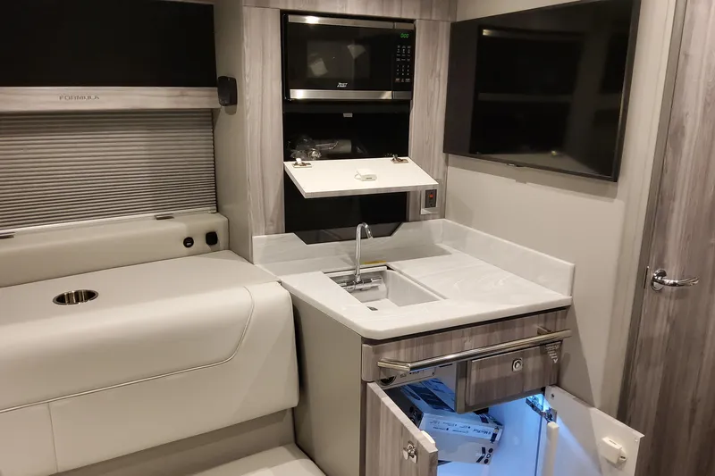  Yacht Photos Pics 2026 Formula 400 Super Sport Crossover interior with kitchenette, sink, and modern appliances.