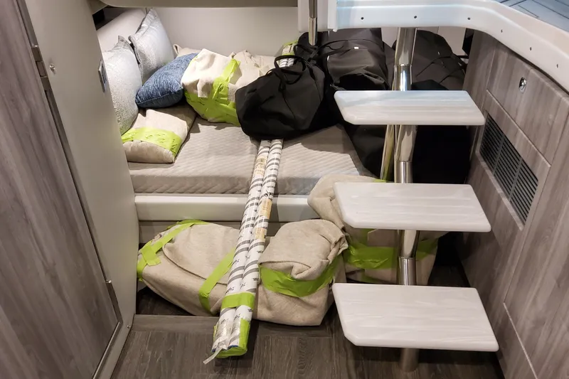  Yacht Photos Pics Interior of 2026 Formula 400 Super Sport Crossover with bedding and storage items.
