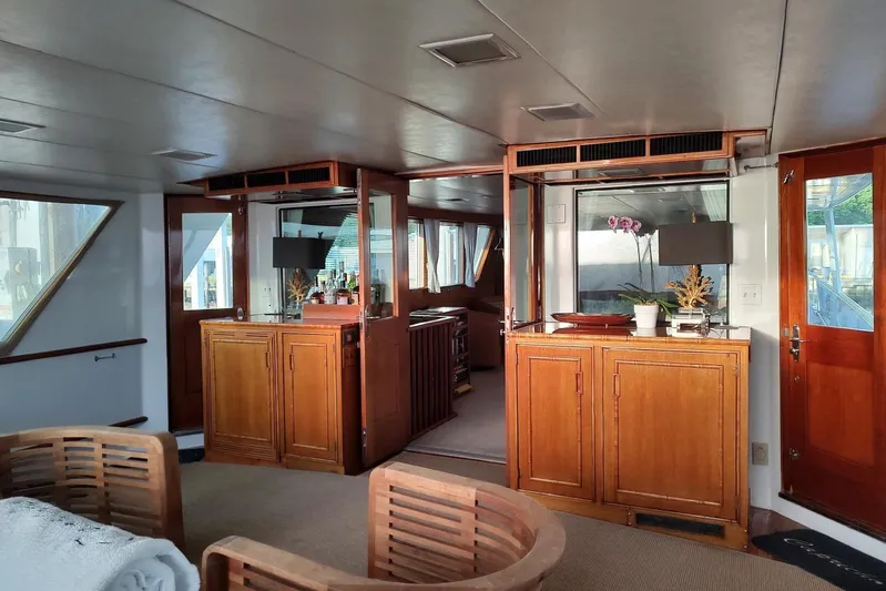 Capricho Yacht Photos Pics Luxurious 1987 Burger Motoryacht interior with elegant wood cabinetry and modern decor.