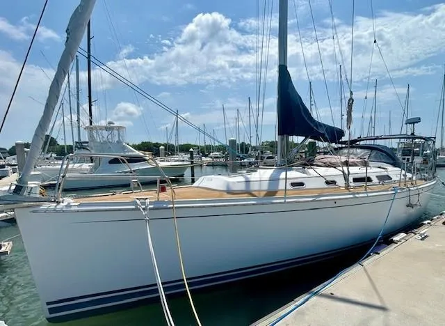 Valanta Yacht Photos Pics 2007 Hanse 400 sailboat docked at marina under blue sky.