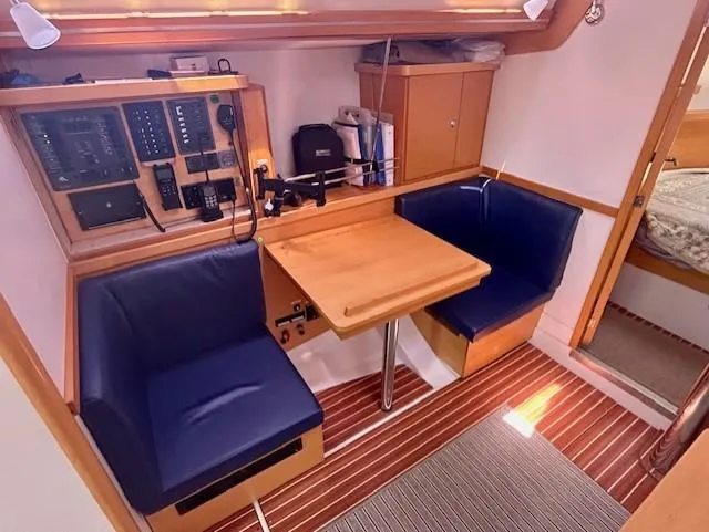 Valanta Yacht Photos Pics Interior of 2007 Hanse 400 yacht with navigation station and seating area.