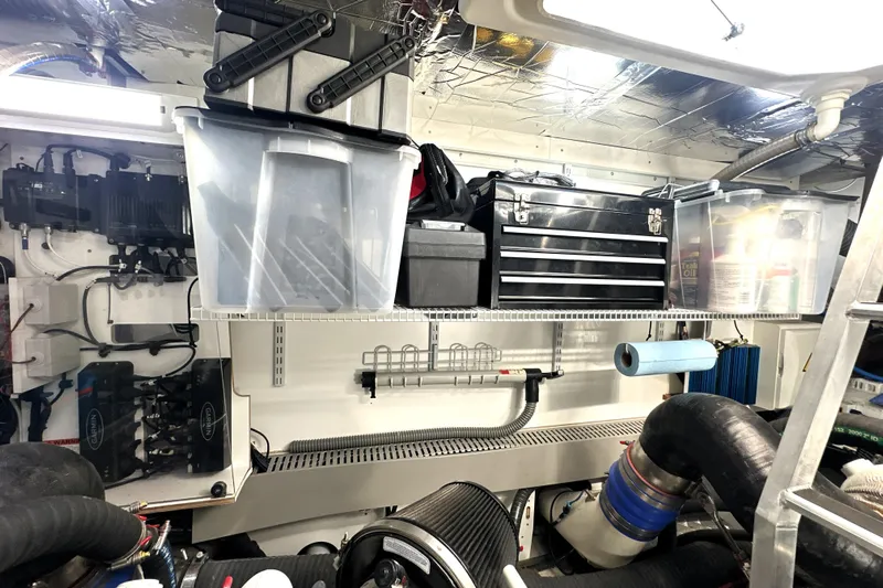Highland Patriot Yacht Photos Pics Engine room of 2023 Prestige 590 yacht with organized tools and storage.