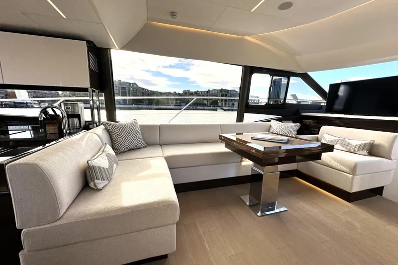Highland Patriot Yacht Photos Pics Luxurious interior of 2023 Prestige 590 yacht with elegant seating and modern design.