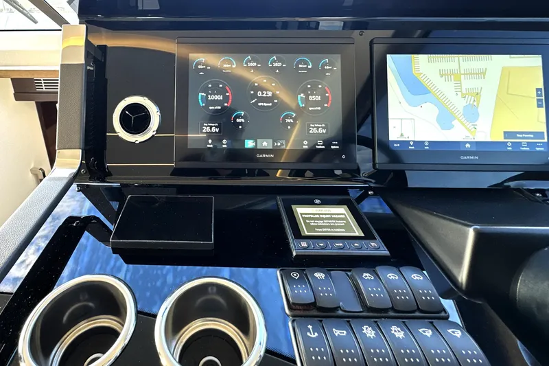 Highland Patriot Yacht Photos Pics Control panel of 2023 Prestige 590 yacht with Garmin navigation displays and controls.