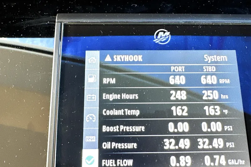 Highland Patriot Yacht Photos Pics Display screen of 2023 Prestige 590 showing engine metrics like RPM and coolant temperature.